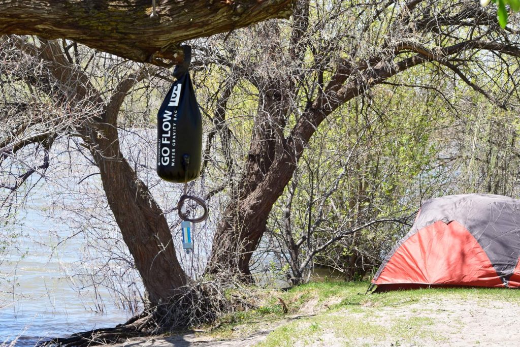 Camping with a water filter gravity bag.